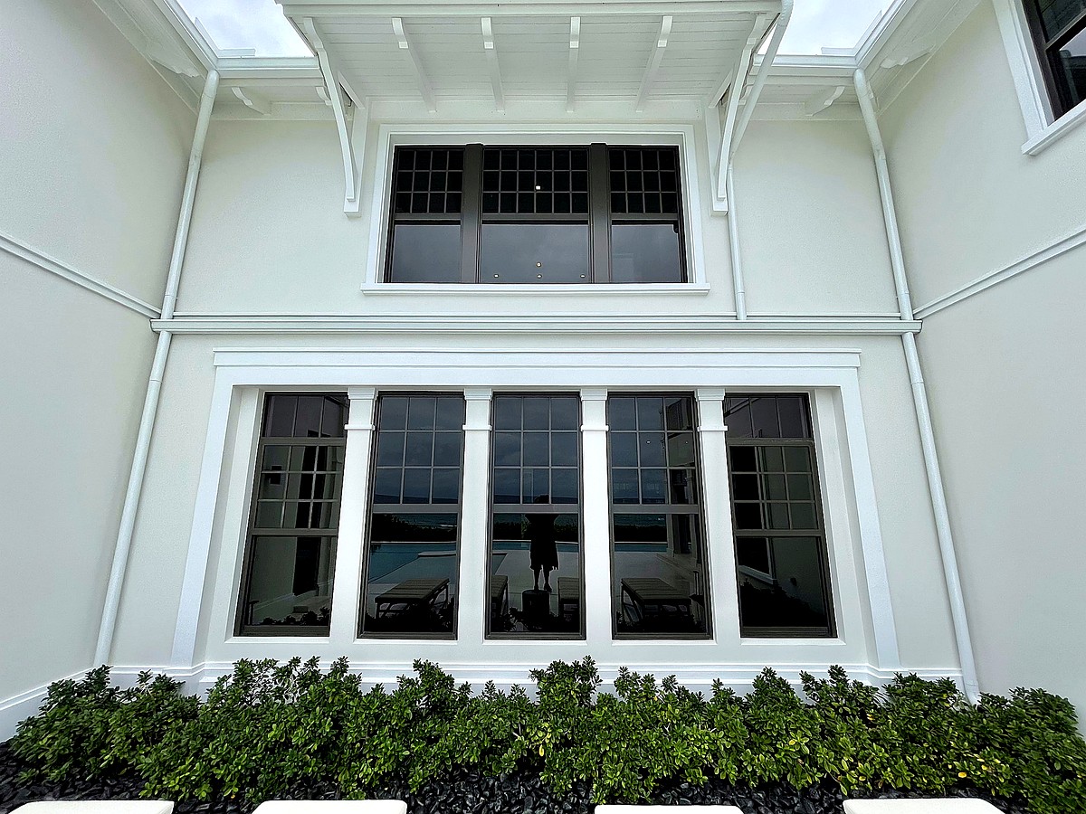 Classic coastal canal home with pristine windows in Lighthouse Point FL