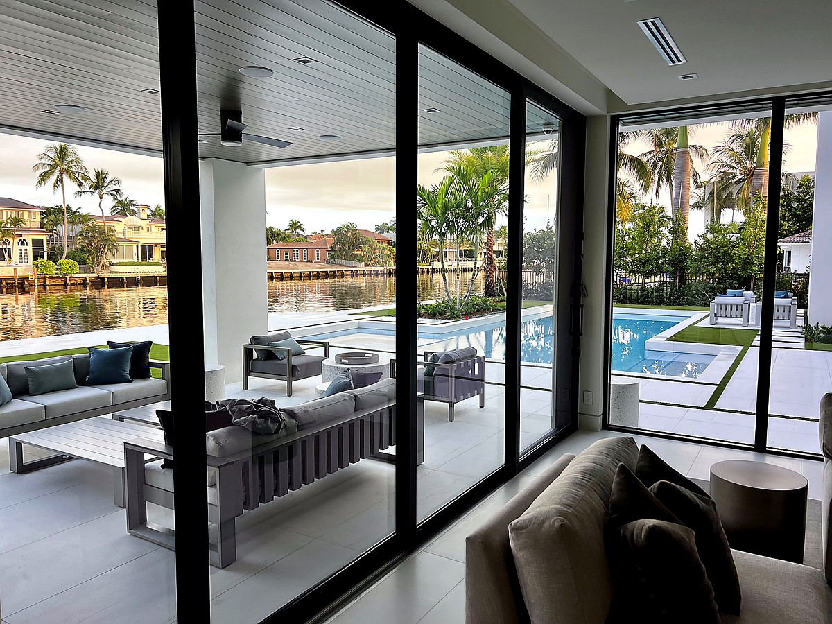 Coastal home with pristine windows overlooking pool area in Boca Raton FL