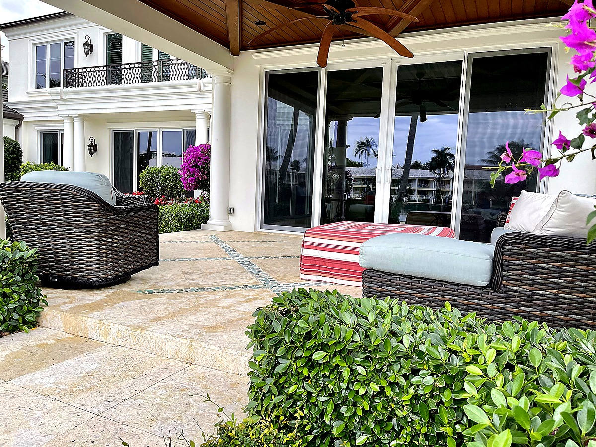 Royal Palm Yacht & Country Club covered patio with pristine glass doors and bougainvillea in Boca Raton