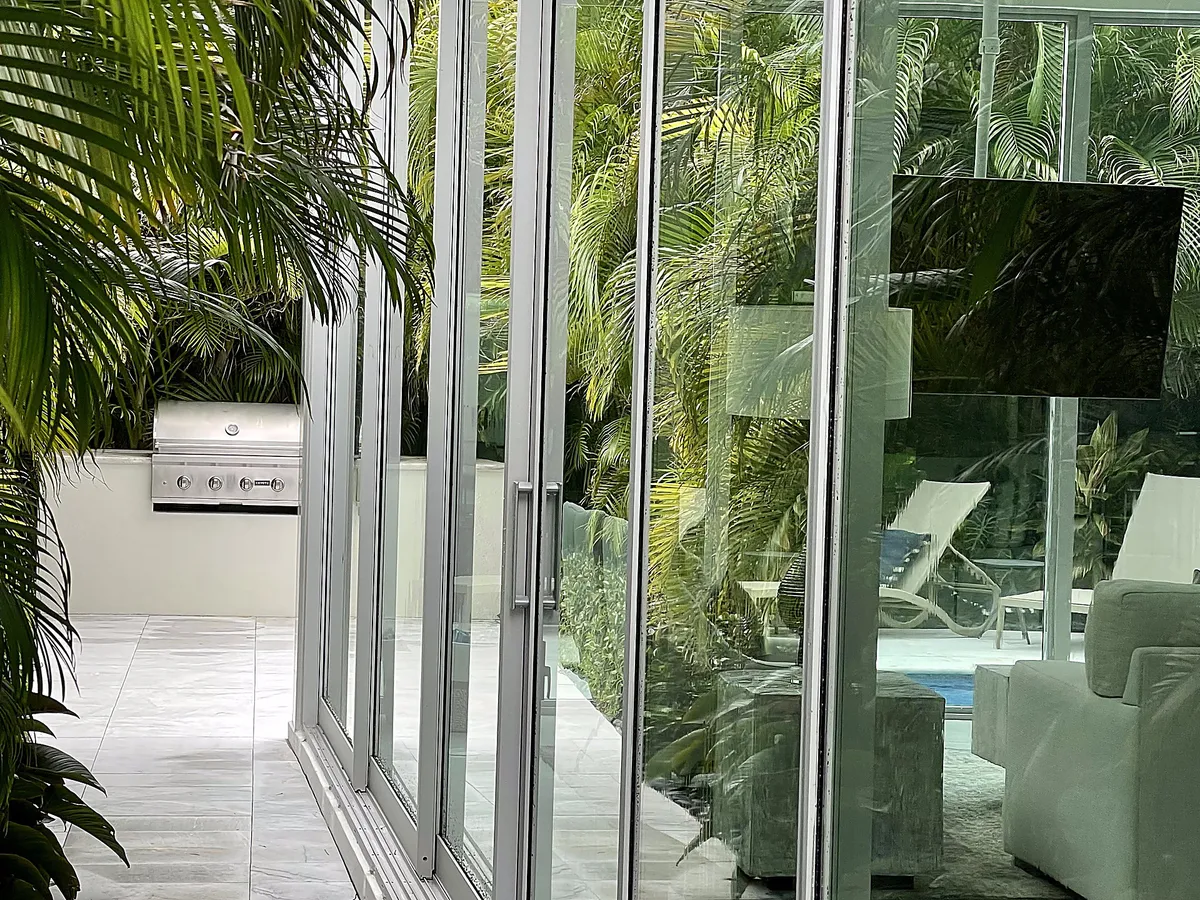 Folding glass doors after cleaning at Deerfield Beach home