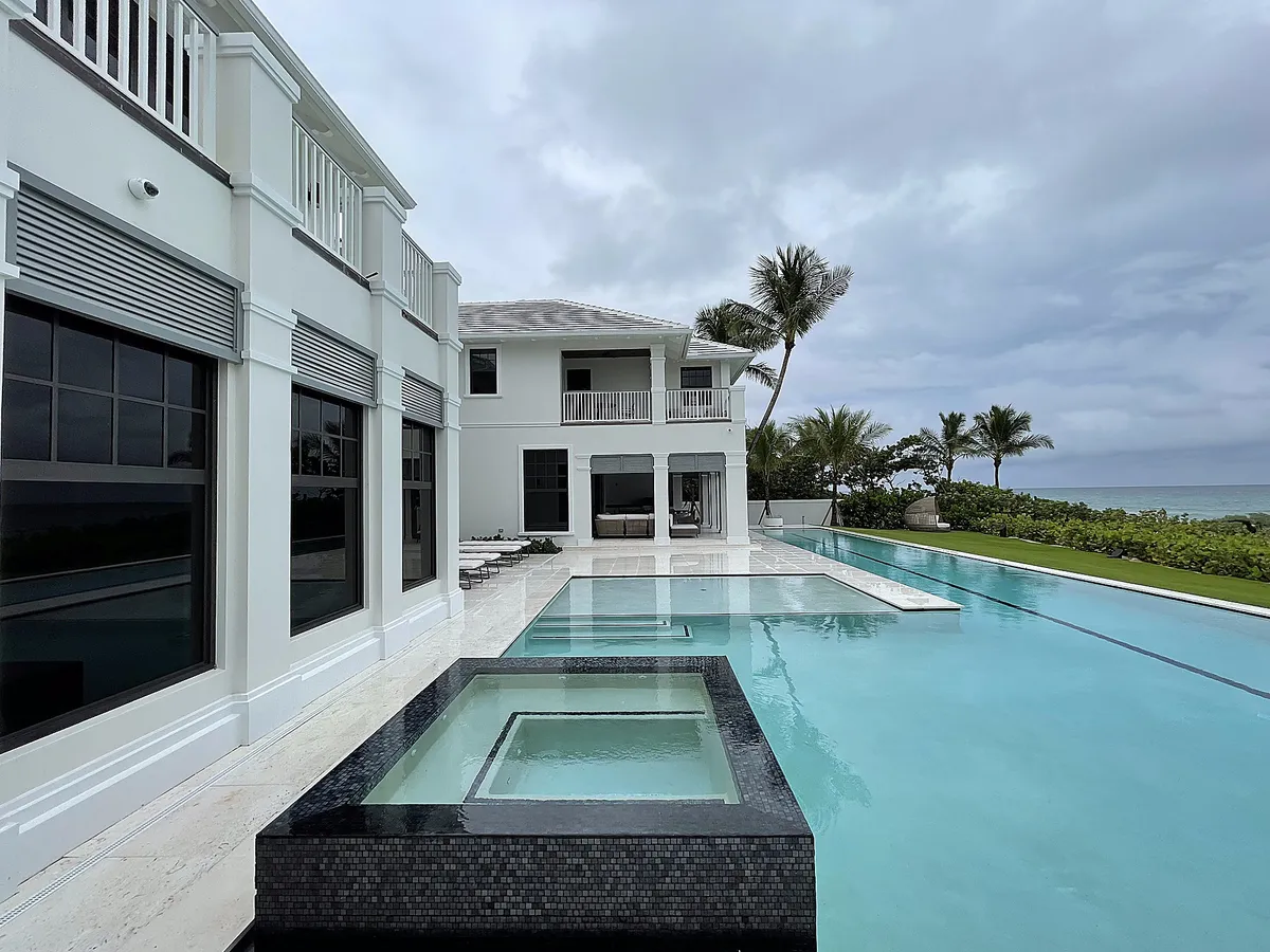 Clean windows at Gulf Stream oceanfront home with pool