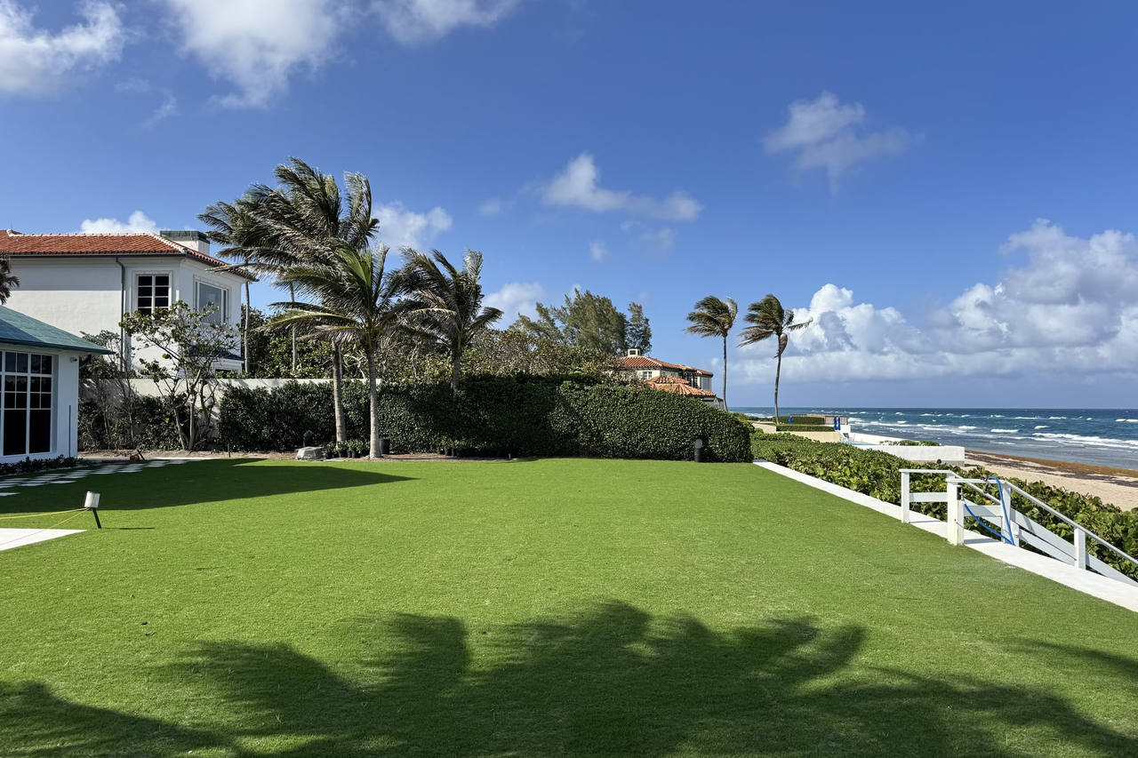 Lush green lawn at oceanfront estate