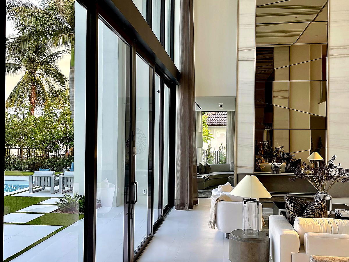 Luxury home interior with pristine floor-to-ceiling glass panels in Delray Beach FL