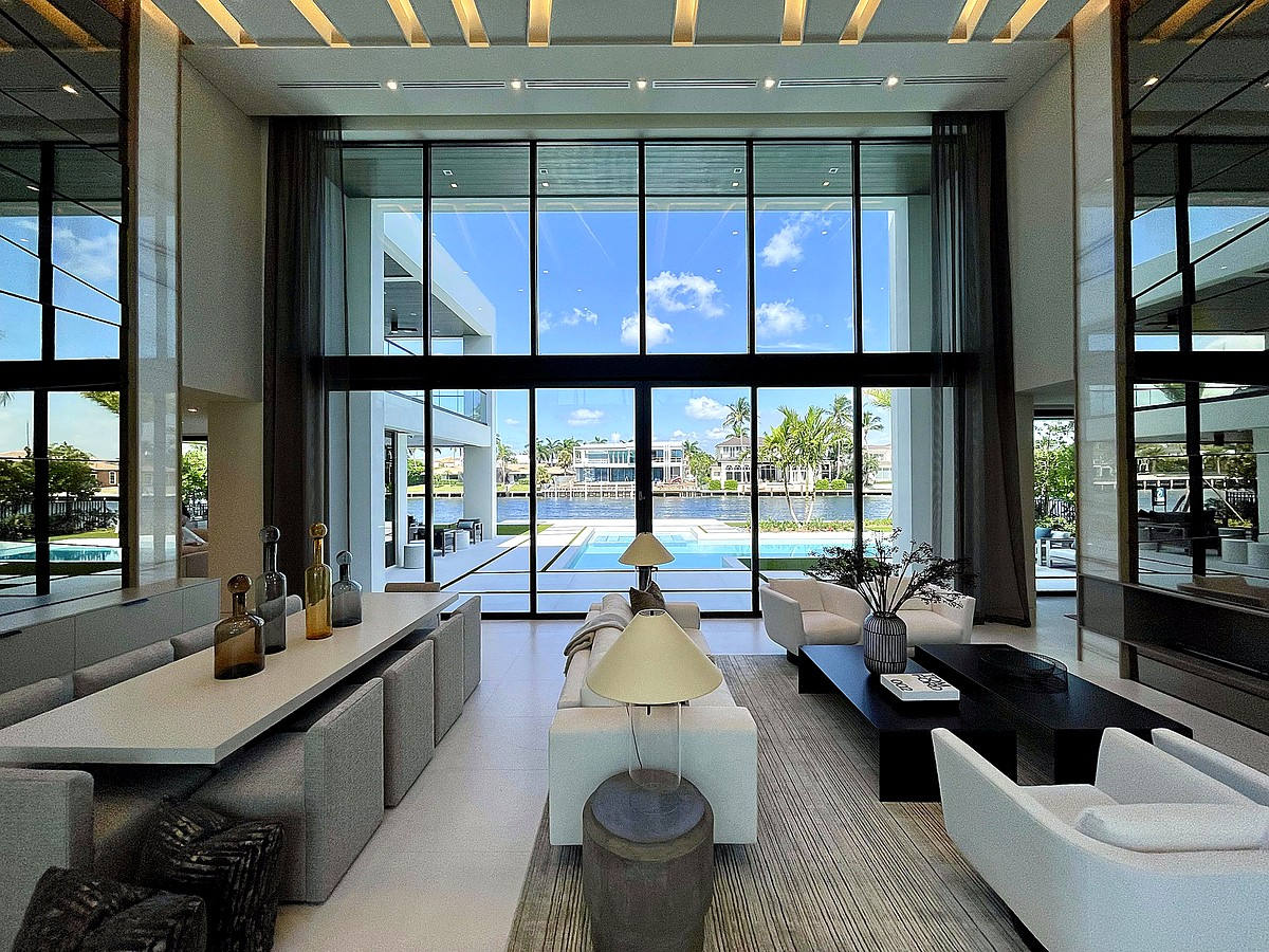 Luxury living room with floor-to-ceiling glass overlooking the Intracoastal Waterway
