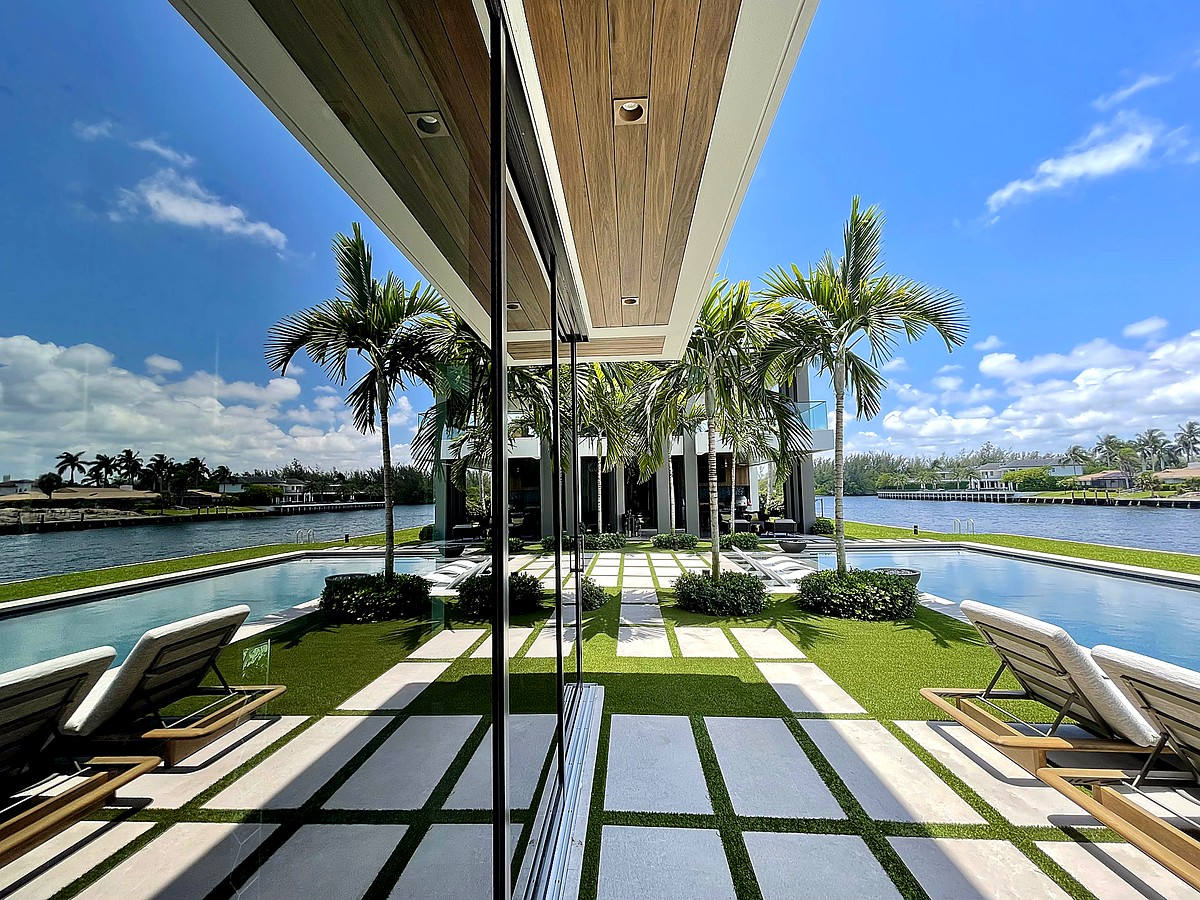 Modern waterfront estate with massive floor-to-ceiling windows overlooking the Intracoastal in Boca Raton