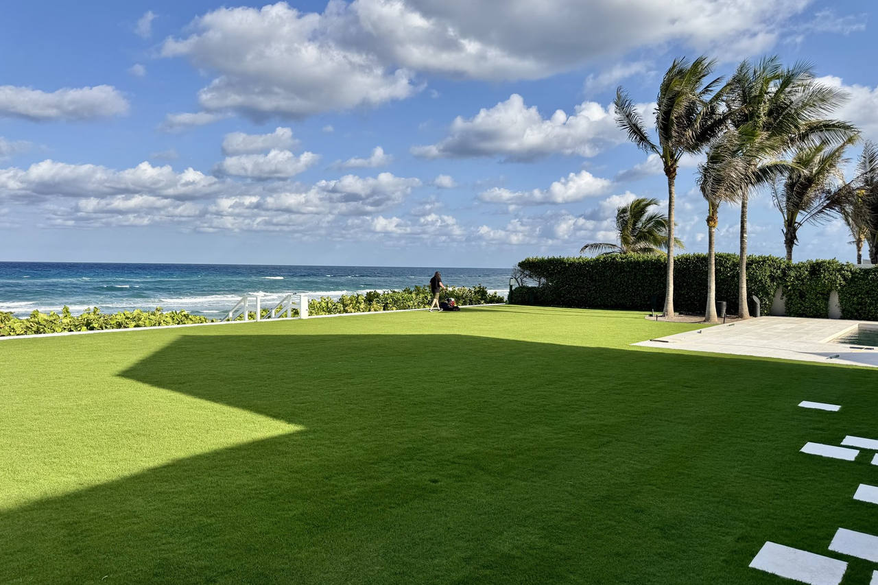 Completed paspalum lawn with ocean and clouds