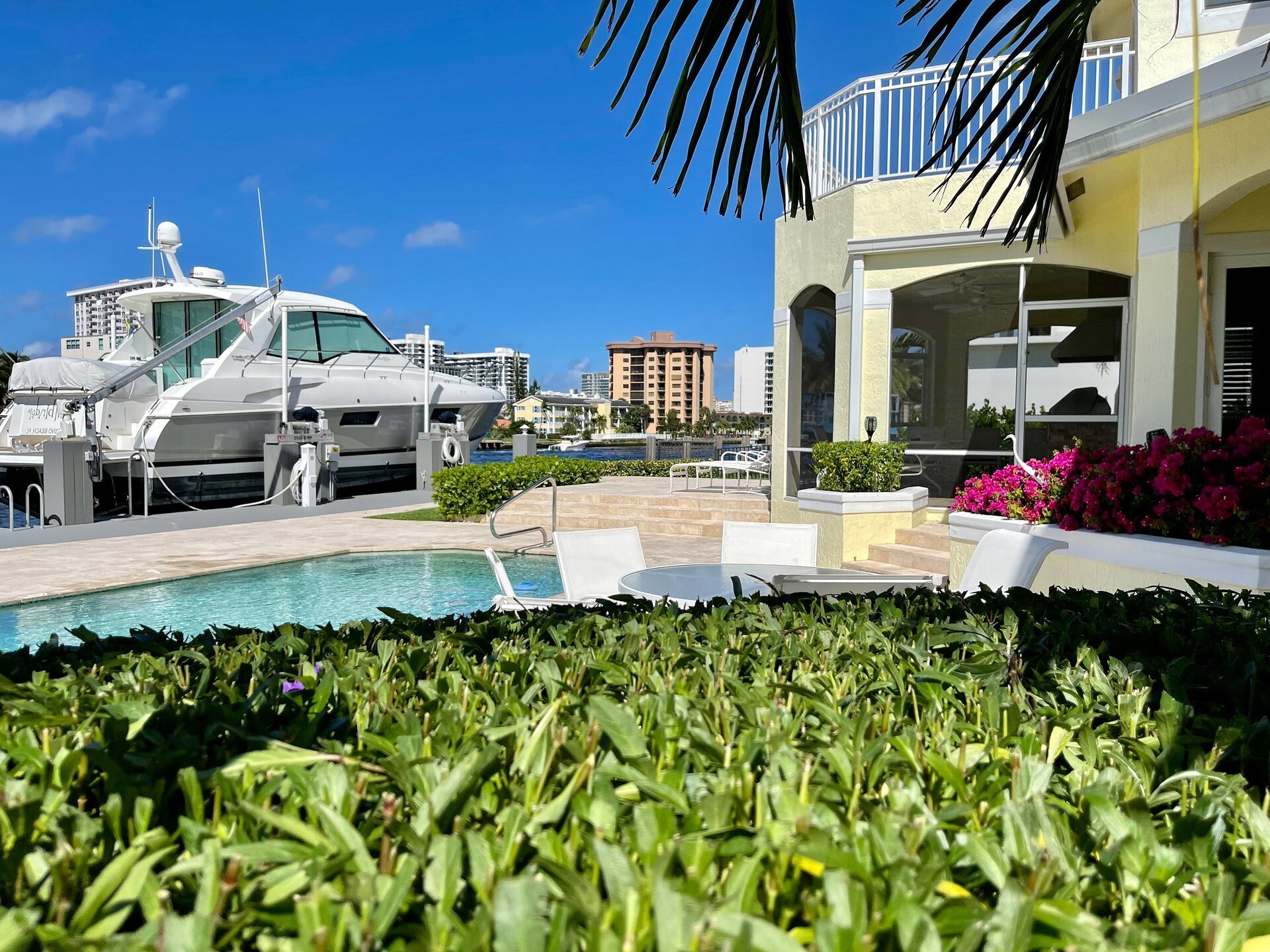Waterfront property management with pool and yacht dock landscaping in South Florida