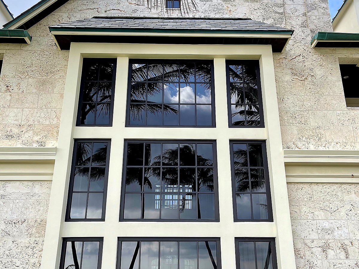 Waterfront Delray Beach home interior with crystal clear glass and canal views